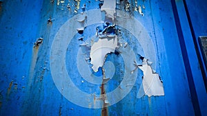 Peeling Blue Wall with Light Surface