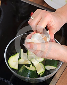 Peeling a clove of garlic