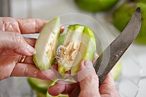 Peeling and cutting ambarella photo