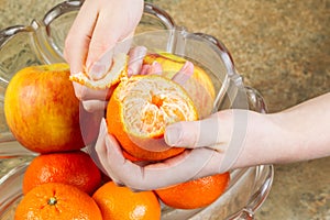 Peeling Orange Fruit by Hand