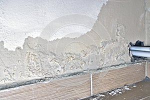 Peeling paint, indicating damp on the bathroom wall. Water Leaks