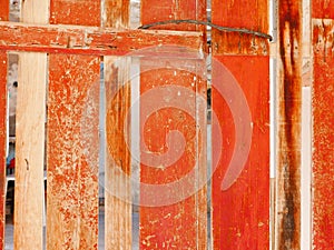 Peeling paint on an old wooden fence