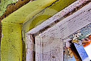Peeling paint on walls of a building