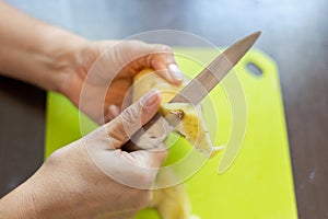 Peeling potatoes close up.