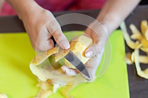 Peeling potatoes close up.