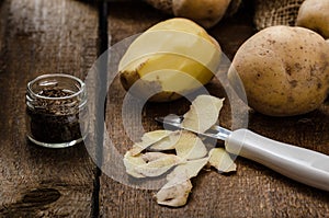 Peeling potatoes for gnocchi dougn on