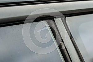 Peeling tint film from glass. Air bubble under tinted car