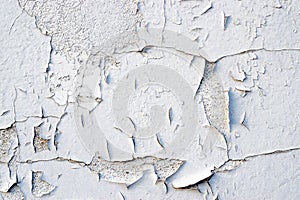 Peeling wall paint. Old flakes wallpaper, worn texture backgroun