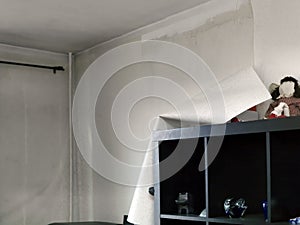 Peeling wallpaper in a modern room