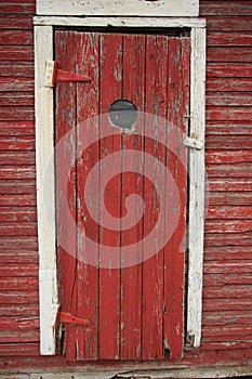 Peep hole in old red door
