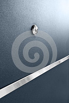 Peephole At Dark Blue Metallic Door With Lock