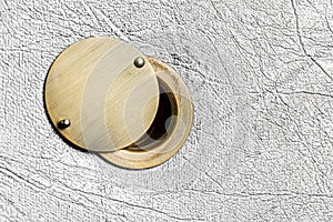 Peephole with an open damper on a light door