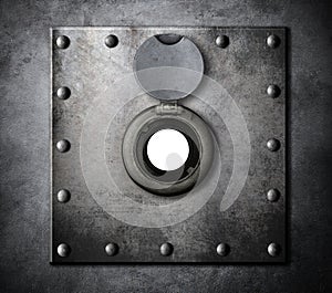 Peephole or peep hole in metal armored door photo