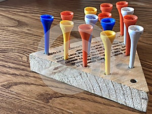Peg jump game with a wooden board