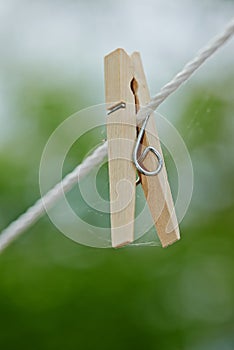 Peg, rope and outdoor for clothes from laundry, clean and dry in nature with plastic clip of closeup. Washing, empty