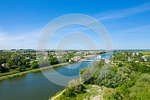 The Pegasus Bridge in the middle of the green countryside in Europe, France, Normandy, towards Caen, Ranville, in summer, on a photo