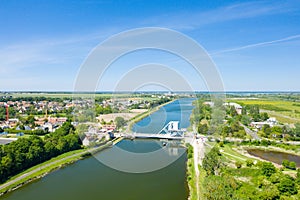 The Pegasus Bridge over the Orne canal in Europe, France, Normandy, towards Caen, Ranville, in summer, on a sunny day photo