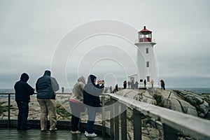 Peggy& x27;s Cove Light House in Nova Scotia with people - oct 2022