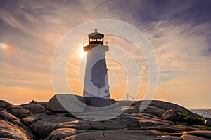 Peggy`s Cove Lighthouse at sunset photo