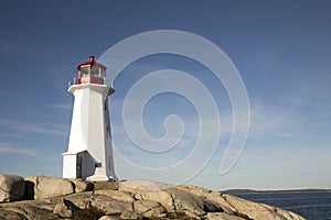 Peggys Cove Lighthouse, Nova Scotia, Canada against blue skies