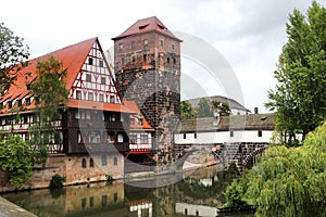 Pegnitz river with old water tower and Hangman\'s bridge in Nuremberg, Germany