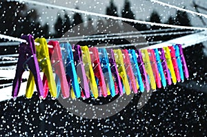 Pegs on a washing line in the rain