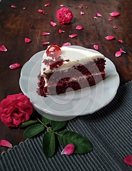 Peice of Red velvet cake with cheese frosting photo