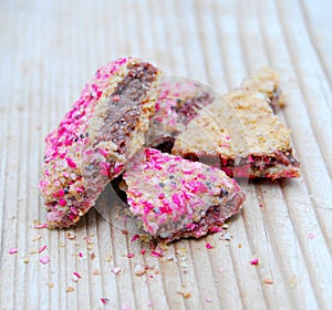 peices of a chopped cereal bar with tasty berry crumbles