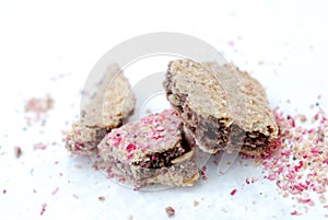 peices of a chopped cereal bar with tasty berry crumbles