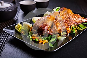 Peking duck breast with pak choi and vegetables