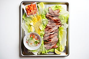 peking duck lettuce wraps on a tray