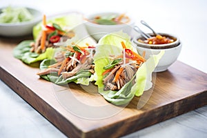 peking duck lettuce wraps on a tray