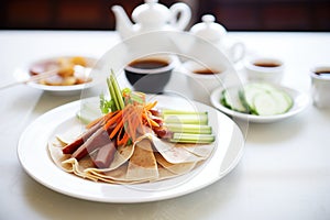 peking duck served with pancakes and hoisin sauce