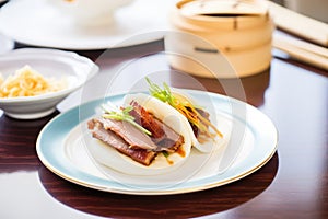 peking duck with steamed buns on side