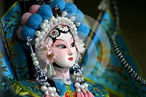 Peking opera doll close up photo