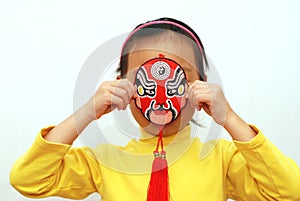 Peking Opera mask and little girl