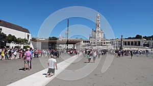 Pelgrim crawling on knees at Basilica of Our Lady of Fatima in Portugal