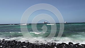 Pelican flying along the coastline of the Galapagos islands