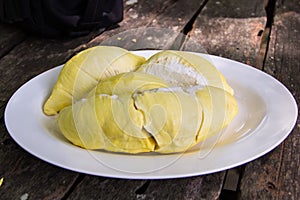 Pelled durian in white ceramic dish on the table