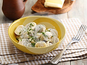 Pelmeni with butter and parsley