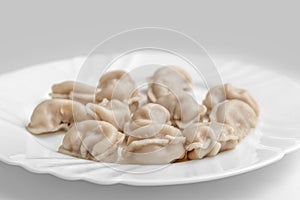 Pelmeni. Meat dumplings on a white plate. Good nutrition. Healthy food.