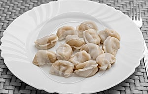 Pelmeni. Meat dumplings on a white plate. Good nutrition. Healthy food.