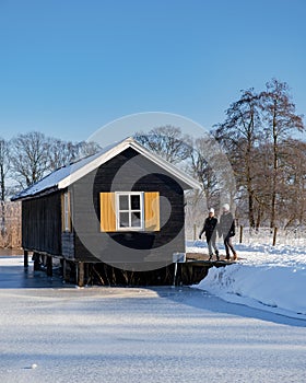 Pelmolen Ter Horst, Rijssen covered in snowy landscape in Overijssel Netherlands, historical wind mill during winter