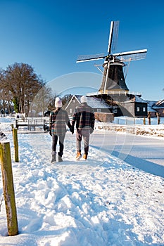 Pelmolen Ter Horst, Rijssen covered in snowy landscape in Overijssel Netherlands, historical wind mill during winter