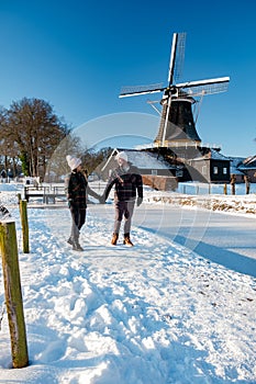 Pelmolen Ter Horst, Rijssen covered in snowy landscape in Overijssel Netherlands, historical wind mill during winter