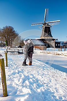 Pelmolen Ter Horst, Rijssen covered in snowy landscape in Overijssel Netherlands, historical wind mill during winter