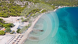 Peloponnese, Greece Aerial view on turqouise blue water and sandy beach. Limni Vouliagmeni or Ireon Lake,