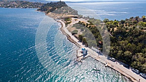 Peloponnese, Greece Aerial view on turqouise blue water and sandy beach. Limni Vouliagmeni or Ireon Lake,