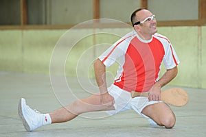 Pelote basque player stretching photo