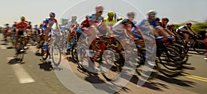 Peloton of bicycle riders during a race